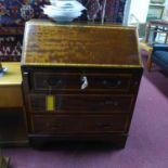 A Georgian style inlaid mahogany bureau with label for Jones & Higgins, H.95 W.76 D.45cm