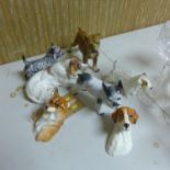 A collection of porcelain dogs to include Royal Doulton and Royal Worcester