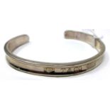 A Tiffany & Co, sterling silver bangle, dia: 7.5cm, 18.9g, clearly hallmarked to centre