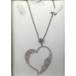 An 18ct white gold heart-shaped pendant set with 4.5 carats of round brilliant cut diamonds on an