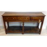 An 18th century oak dresser base with three drawers, H.77 W.145 D.43cm