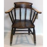 An early 20th century oak captains desk chair