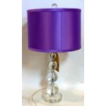 A contemporary perspex table lamp with spherical stem and purple sateen shade, H: 60cm