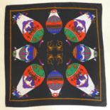 A Hermes, Paris, silk scarf, with hot air balloons and cherubs on a black ground, 85 x 85cm