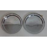 Two large Christofle circular serving trays in stainless steel, both signed, dia: 39cm each