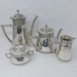 A silver plated four piece tea set, marked OAG C to bases, comprising a teapot, hotwater pot, milk