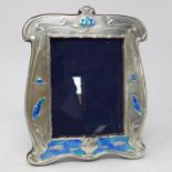 A sterling silver and hand enamelled easel back picture frame in the Art Nouveau style, 21 x 17cm