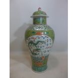 A Chinese Republic period famille rose lidded temple jar, hand-enamelled with dragons and carp,