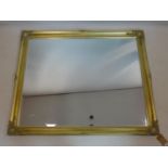 A large gilt framed outswept mirror, with bevelled plate, 104 x 126cm