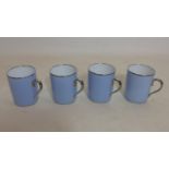 4 boxed, Legle Limoges, porcelain mugs in pale blue and platinum edging, H: 9.5cm each