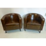 A pair of leatherette tub chairs on chrome and brass supports (2)
