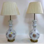 A pair of Chinese porcelain table lamps with armorial crest, H.50cm