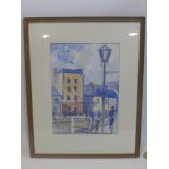 A watercolour of a townscape, unsigned, framed and glazed, 47 x 34cm