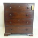 A 19th century mahogany secretaire chest, with fitted interior above three long drawers, on