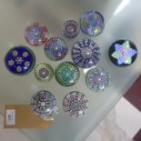 A collection of 12 Millefiori glass paperweights, to include Perthshire examples (12)