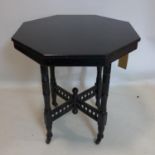 A late 19th / early 20th century octagonal wooden side table painted black with spindle legs on