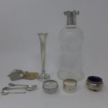 A cut glass decanter with scalloped silver lid, Birmingham 1904, H.24cm, together with a filled