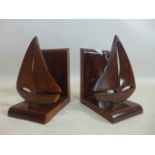 A pair of hardwood bookends in the form of sailing boats from Barbados, 18 x 15cm
