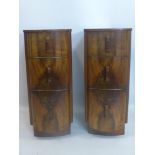 A pair of Art Deco walnut pedestal chests, the quarter veneered tops above three small drawers, H.77