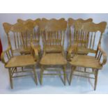 A set of 6 hand-carved beech dining chairs including 2 carvers, H: 107cm, W: 55cm