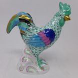 A Herend hand-painted porcelain cockerel, on naturalistic base, the reverse with blue printed