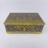 A brass bound lidded trinket box by Fortuny, Venice, (L'objet range), on stepped brass feet and