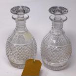 A pair of crystal decanters with stoppers, H.25cm