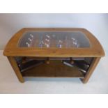 An oak coffee table with glass top converted into a football table with 2 small stools, H: 53, L: