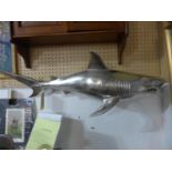 A nickel plated model of a shark