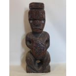 A 20th century hand carved hardwood Maori Tiki with Paua shell eyes, signed D.Edwards 1980, H.101cm