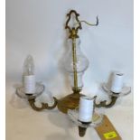 A gilt metal and glass chandelier