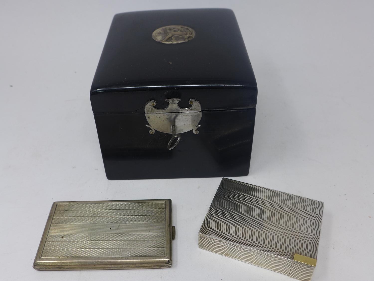 A vintage silver compact stamped 925, together with a white metal card case stamped with mark and