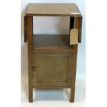 A Waring & Gillows oak drop flap side table, H.76 W.79 D.33cm