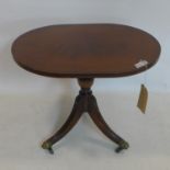 A Regency style mahogany lamp table, raised on splayed legs and castors, H.50 W.62 D.46cm