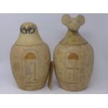 A pair of Egyptin canopic style jars, H.36cm