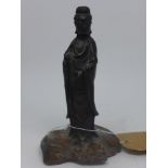 A 19th century Chinese bronze study if Guan Yin on hardwood base, H.18cm