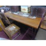 A 20th century teak plank top dining table, set with tiles, raised on hairpin legs, H.75 W.154 D.