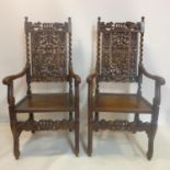 A pair of 19th century carved oak throne chairs