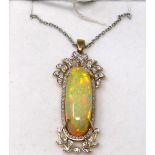 A 14ct yellow and white gold, large natural, oval opal and diamond set pendant on an 18ct white gold