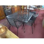 A metal mesh garden table and 4 chairs