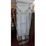 A cast aluminium mirrored back hall stand