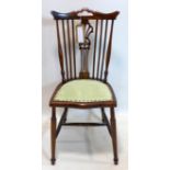 A late 19th century mahogany stick back chair