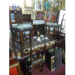 A mahogany dining table and six matching chairs