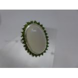 A sterling silver moonstone and green garnet cluster ring, the large central moonstone cabochon 2