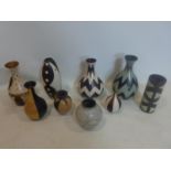 A collection of 9 Peruvian pottery vases