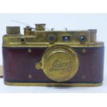 A Leica brass and mahogany camera