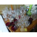 A collection of glassware, to include green art glass vase, a floral etched glass vase, wine