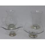 Four glass items with silver bases having various markings