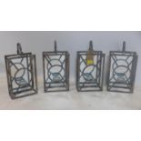 A set of 4 tea light candle holders