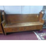 A Victorian pine church pew with 5 cupboard doors, H.106 W.182 D.47cm